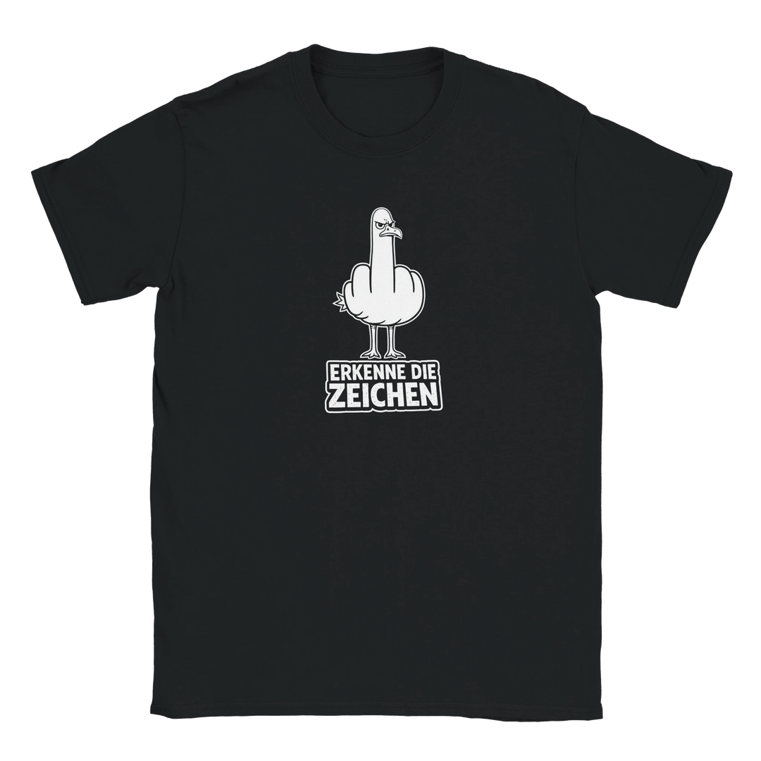 Flatlay des schwarzen T-Shirts mit weißem Möwen-Stinkefinger-Motiv und Schriftzug „Erkenne die Zeichen“.