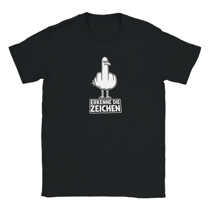 Flatlay des schwarzen T-Shirts mit weißem Möwen-Stinkefinger-Motiv und Schriftzug „Erkenne die Zeichen“.